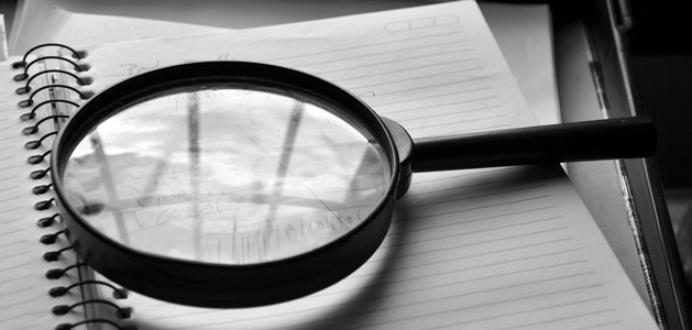 image of magnifying glass on notebook